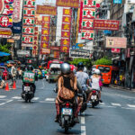 Women passenger on motor bike taxi