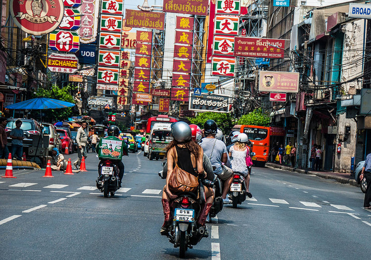 Women passenger on motor bike taxi