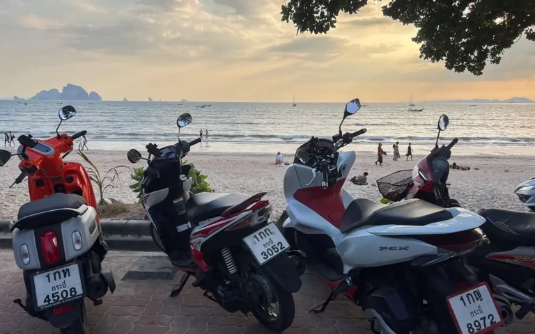 Motorcycles parked at beach in pattaya thailand