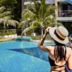 luxury and budget hotels in pattaya sitting by the pool
