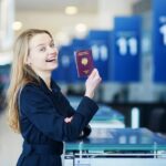 Young-woman-in-bangkok-airport-at-check-in-counter-with-her-passport