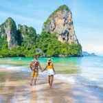 couple walking along one of the many best beaches in thailand for tourist