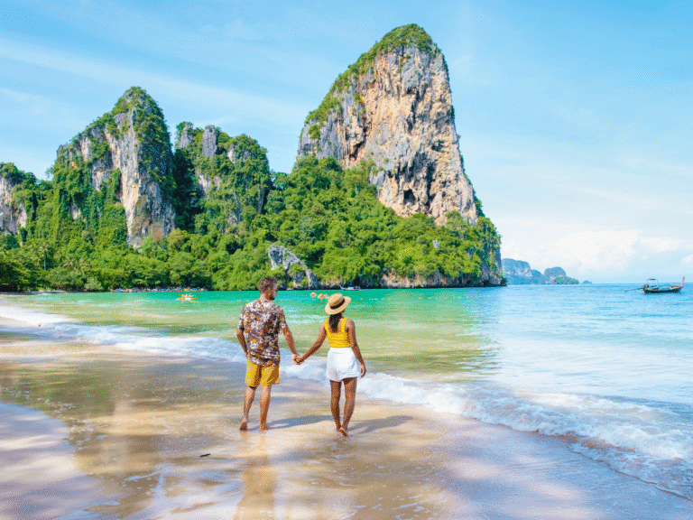 couple walking along one of the many best beaches in thailand for tourist